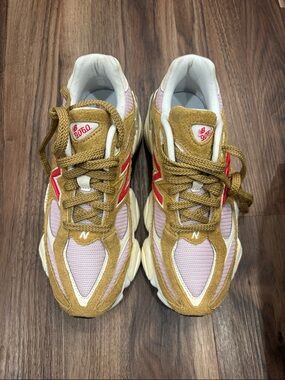New Balance sneakers in pink, tan & red accents